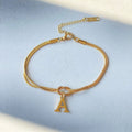 Bracciale con iniziale e nodo d'amore, acciaio inox